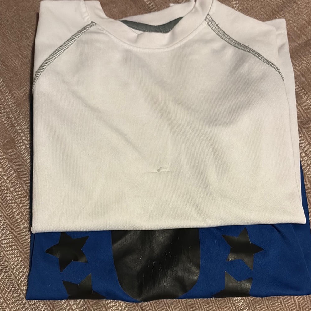 Stylish White and Blue T-Shirt with Black Star Accents
